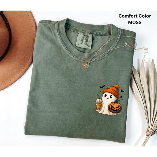 Folded green t-shirt with Halloween ghost design on a white background
