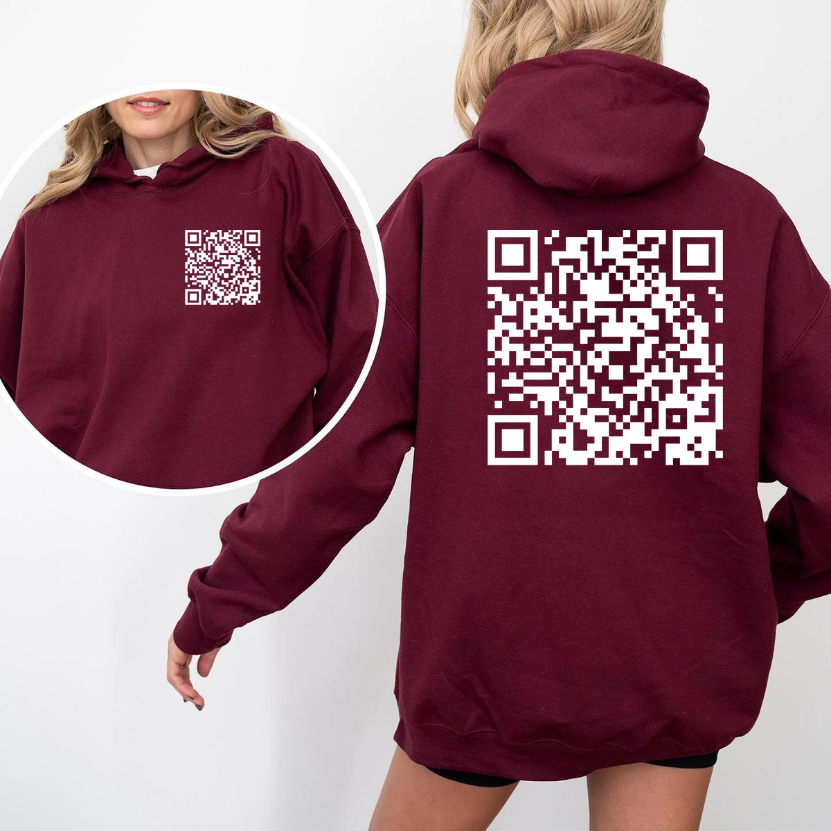 Maroon hoodie with a QR code on the front and back worn by a person.
