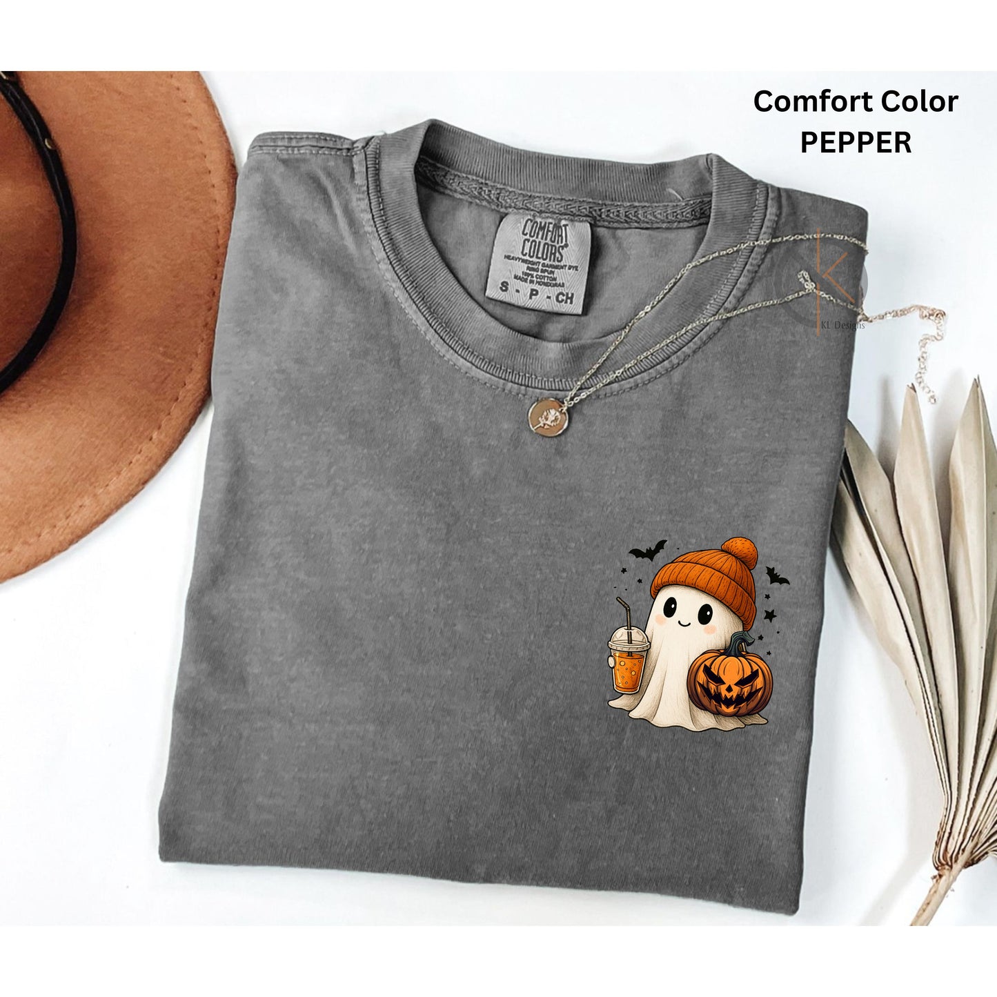 Folded gray t-shirt with Halloween ghost design on a white background